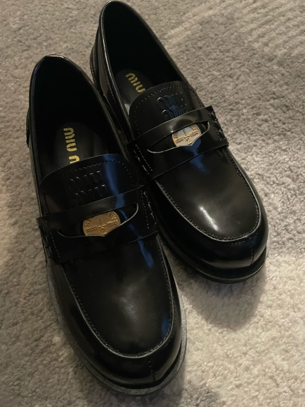 Miu Miu Black Patent Leather Loafers with Gold Plaque